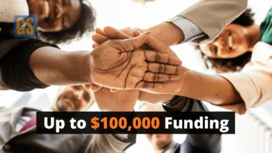 A collaborative community team joining hands for the Aboriginal Community-Led Cancer Research Grant 2026 project in Australia.