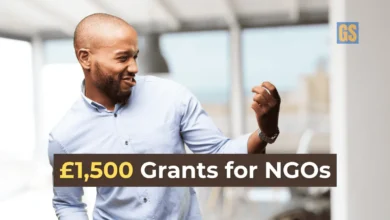 A happy entrepreneur celebrating success after securing the Africa Impact Finance Initiative Grants 2026 for community projects.