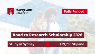 An international student on campus representing the fully funded Road to Research Scholarship 2026 at Macquarie University in Sydney with a $39,700 stipend.